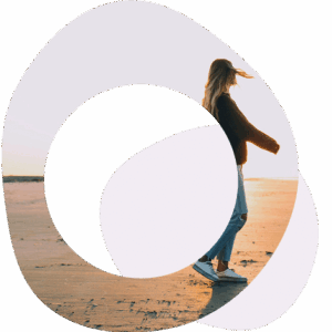 Abstract circles image of lady walking on a beach, wearing a baseball hat