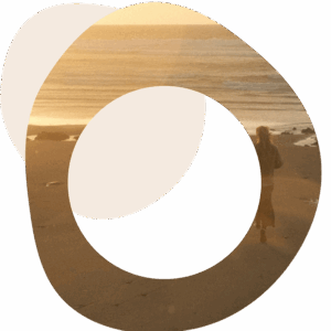 Abstract image of someone standing on a beach looking out to sea