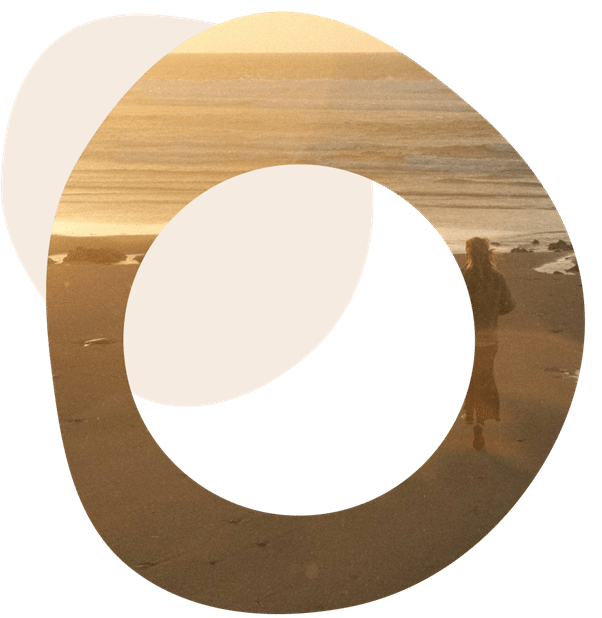 Abstract image of someone standing on a beach looking out to sea